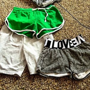Green short size medium black shirts small grey shorts small.